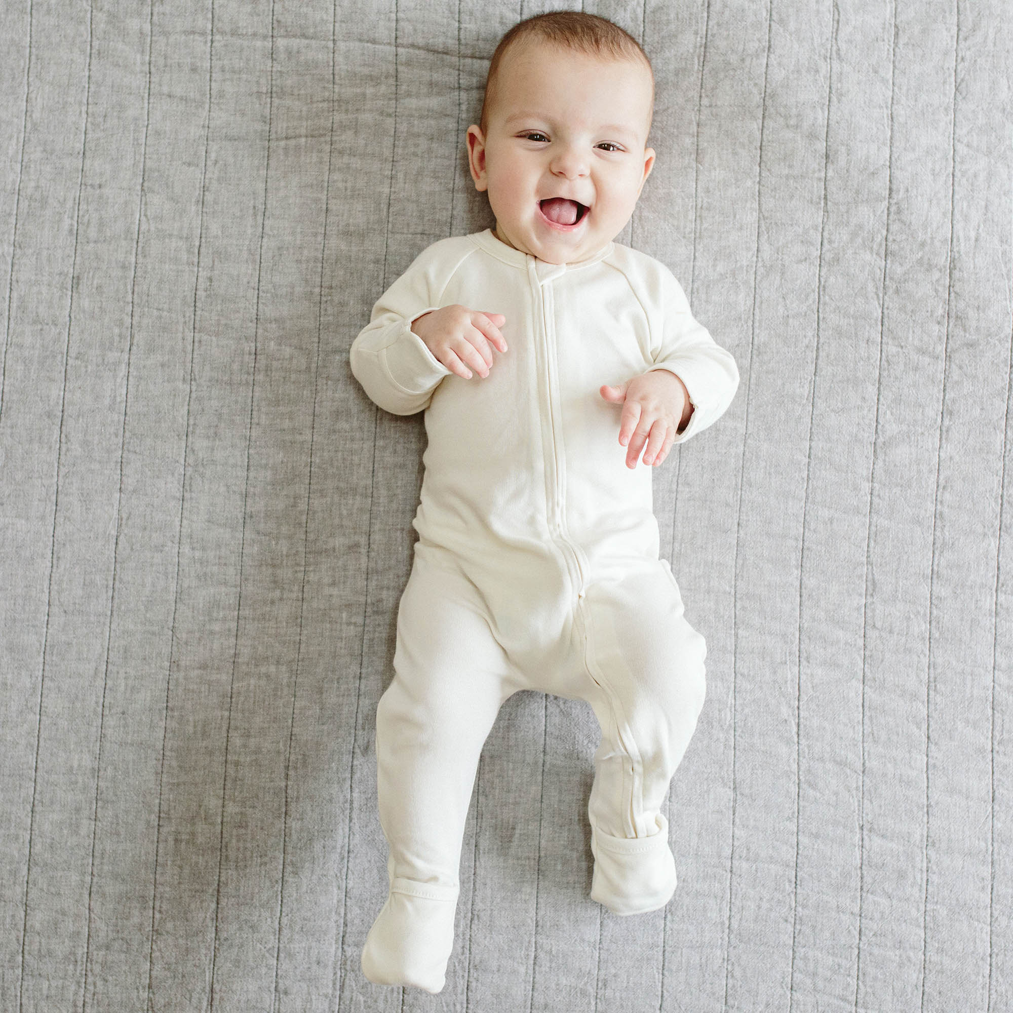 Goumi Kids Cloud Baby Layette Gift Set – stay-on mitts & boots, convertible sleeper gown, grow-with-you footie, gift-packaged – lifestyle