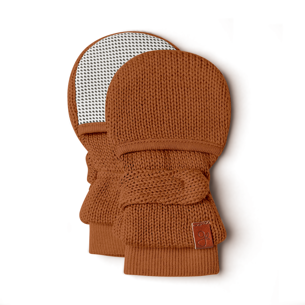 Knit Mitts in clay-brown knit with chunky ribbed cuffs, adjustable wrist closure and black-and-white patterned reverse