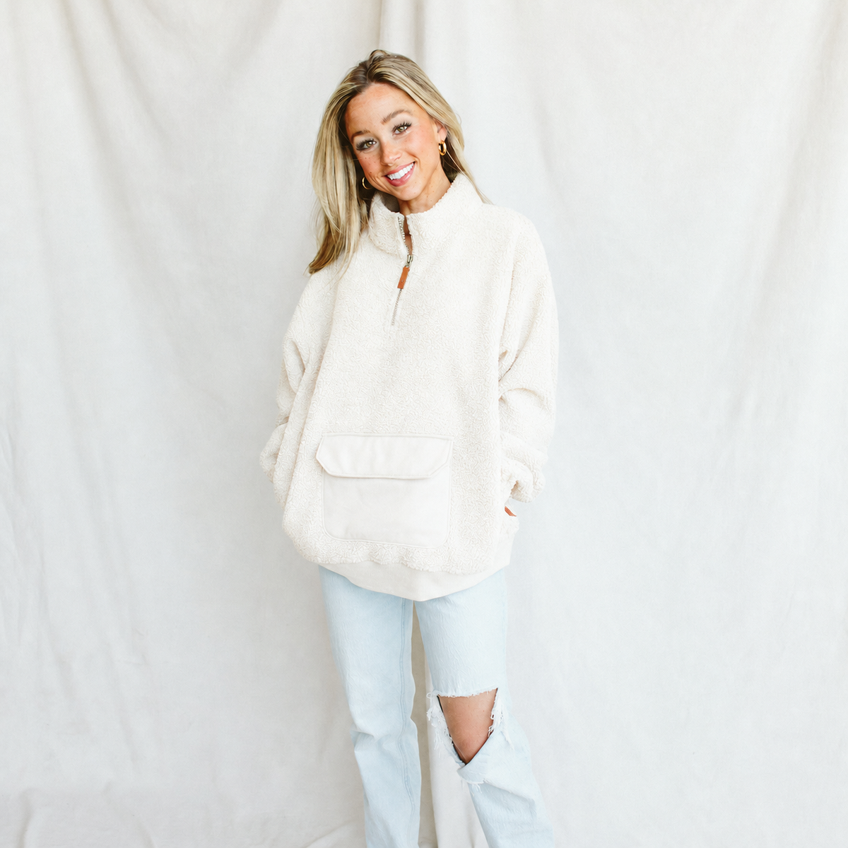 ADULT SHERPA ZIP PULLOVER in alabaster, plush white sherpa with a half-zip neckline and front pouch pocket