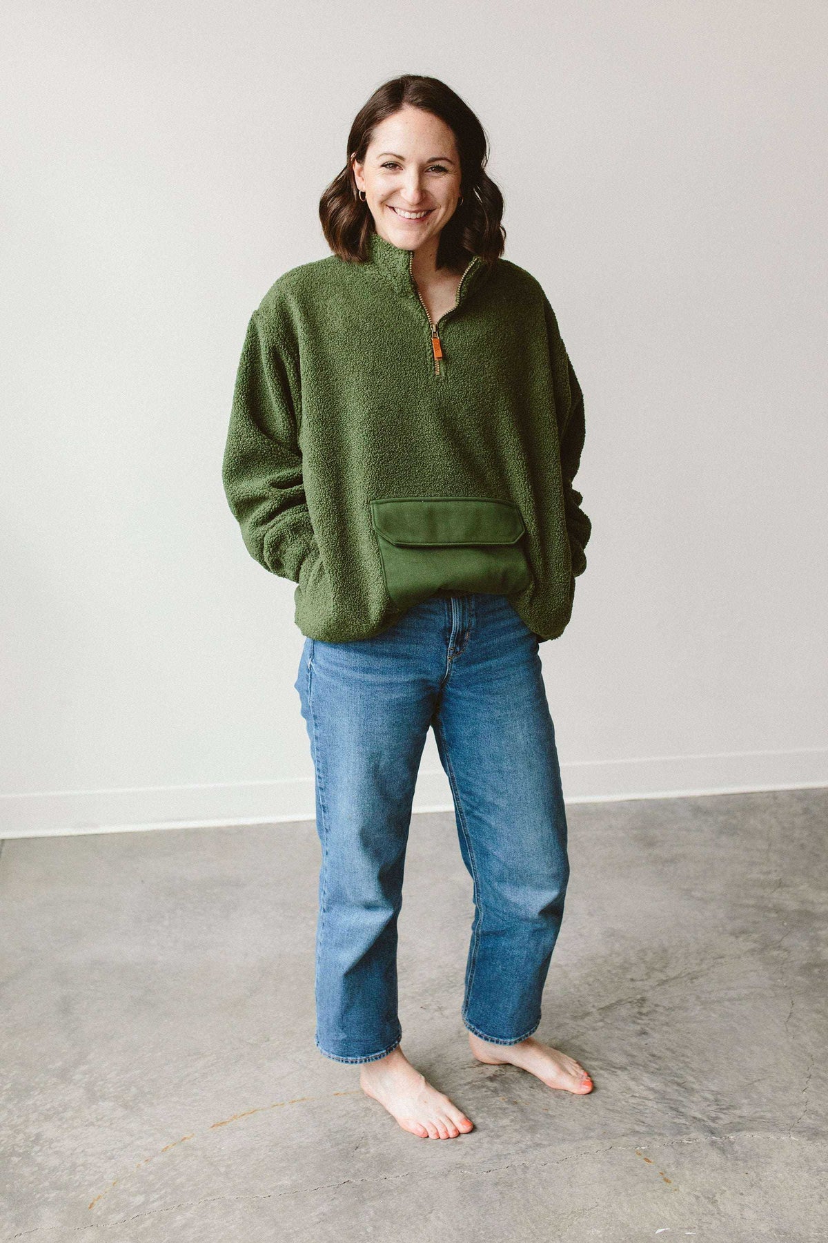 Adult Sherpa Zip Pullover in forest green plush sherpa, featuring a short zip neckline and front kangaroo pocket