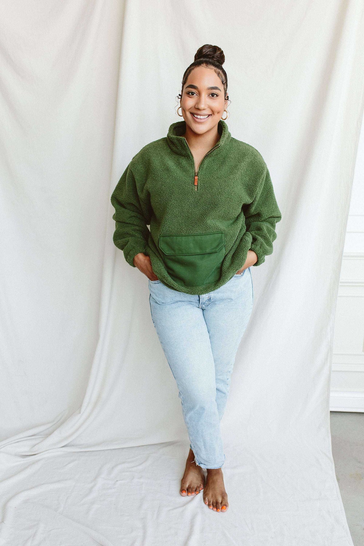 Adult Sherpa Zip Pullover in spruce green plush fleece, featuring a half-zip neckline and large front kangaroo pocket
