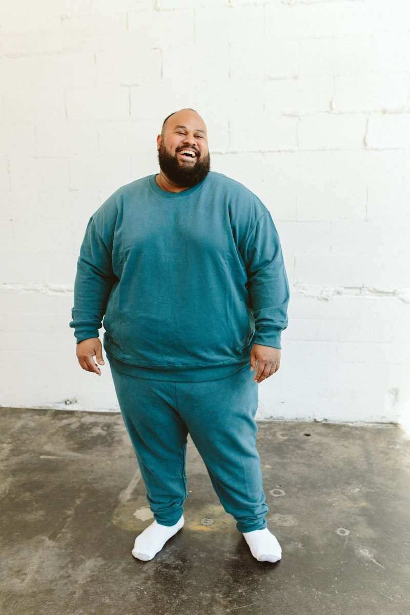 ADULT SWEATSUIT PANT in teal cotton terry, shown with a matching crewneck sweatshirt and cuffed ankles