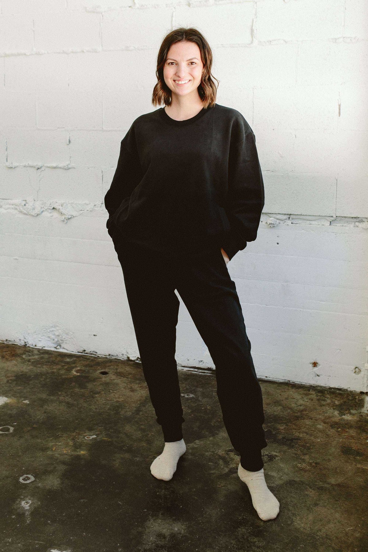 ADULT SWEATSUIT TOP in black cotton terry, with a relaxed fit, crew neckline, and long sleeves, paired with matching pants