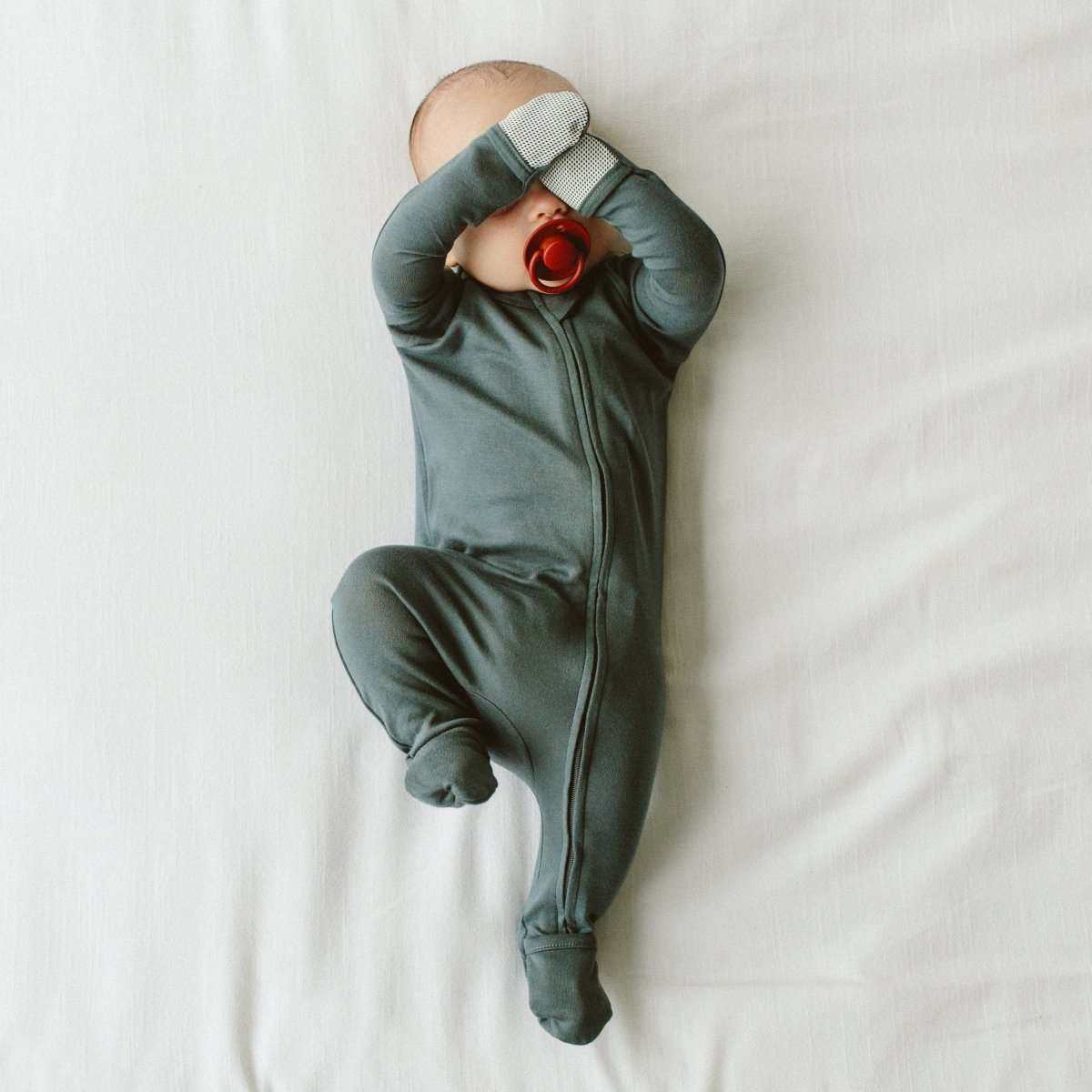 GROW WITH YOU FOOTIE in dark midnight blue-green, with a soft knit finish, built-in mitts and convertible foot cuffs