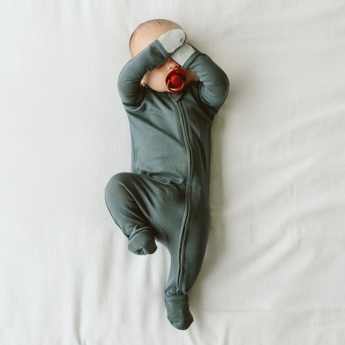 Goumi Kids MIDNIGHT Grow With You Baby Footie Snug Fit – bamboo viscose organic cotton blend – on baby