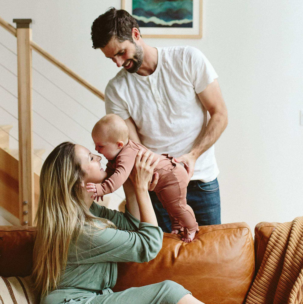 GROW WITH YOU FOOTIE in muted terracotta bamboo cotton blend, with long sleeves and covered feet for babies