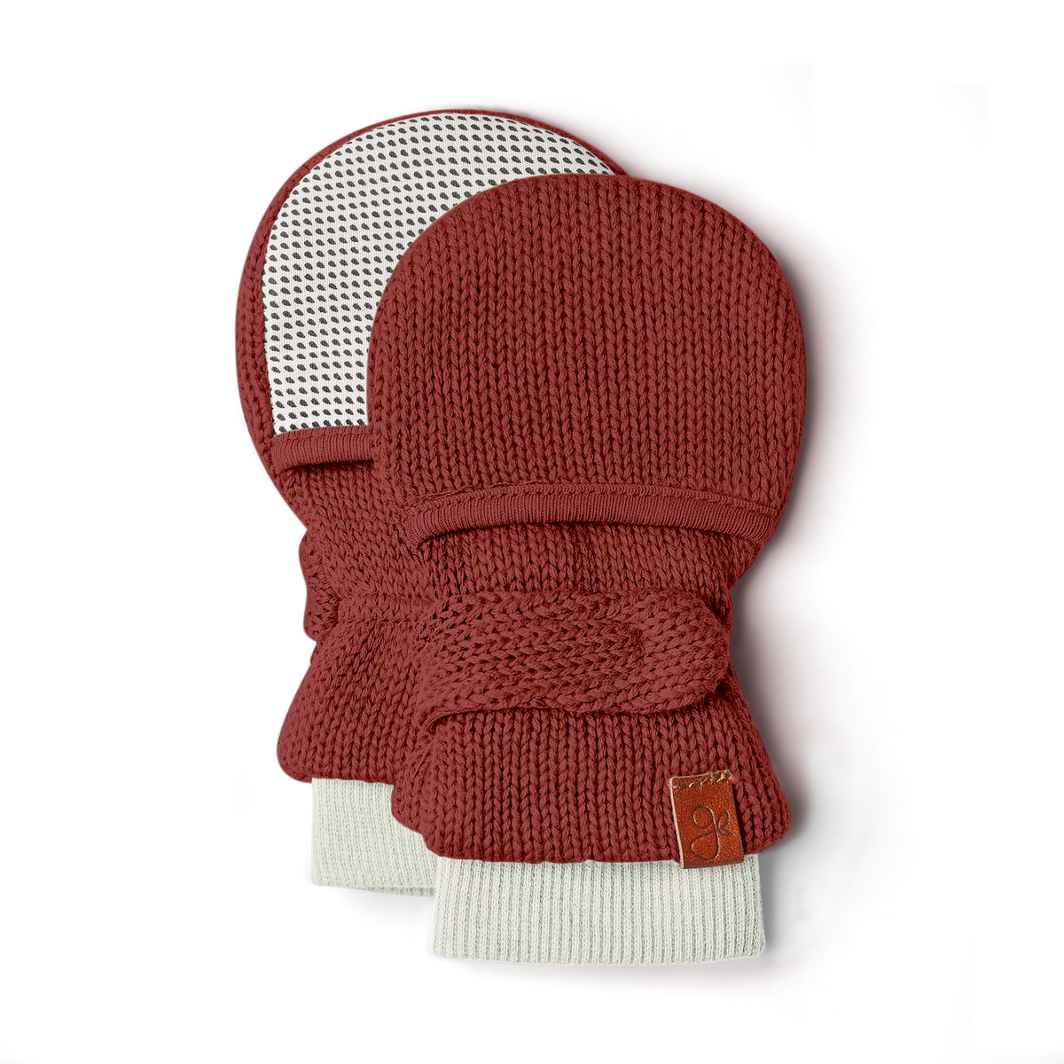 KNIT MITTS in rust-red organic cotton knit with chunky cream ribbed cuffs, wraparound closures and a leather label