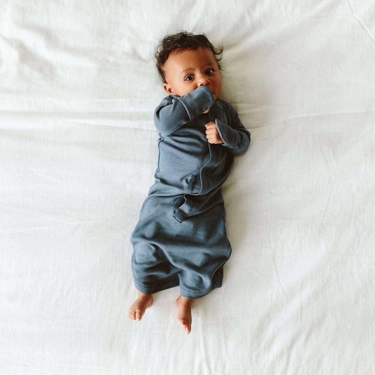 PREEMIE 24 HOUR CONVERTIBLE GOWN in midnight blue, soft solid fabric with long sleeves, built-in mitts and a convertible snap closure