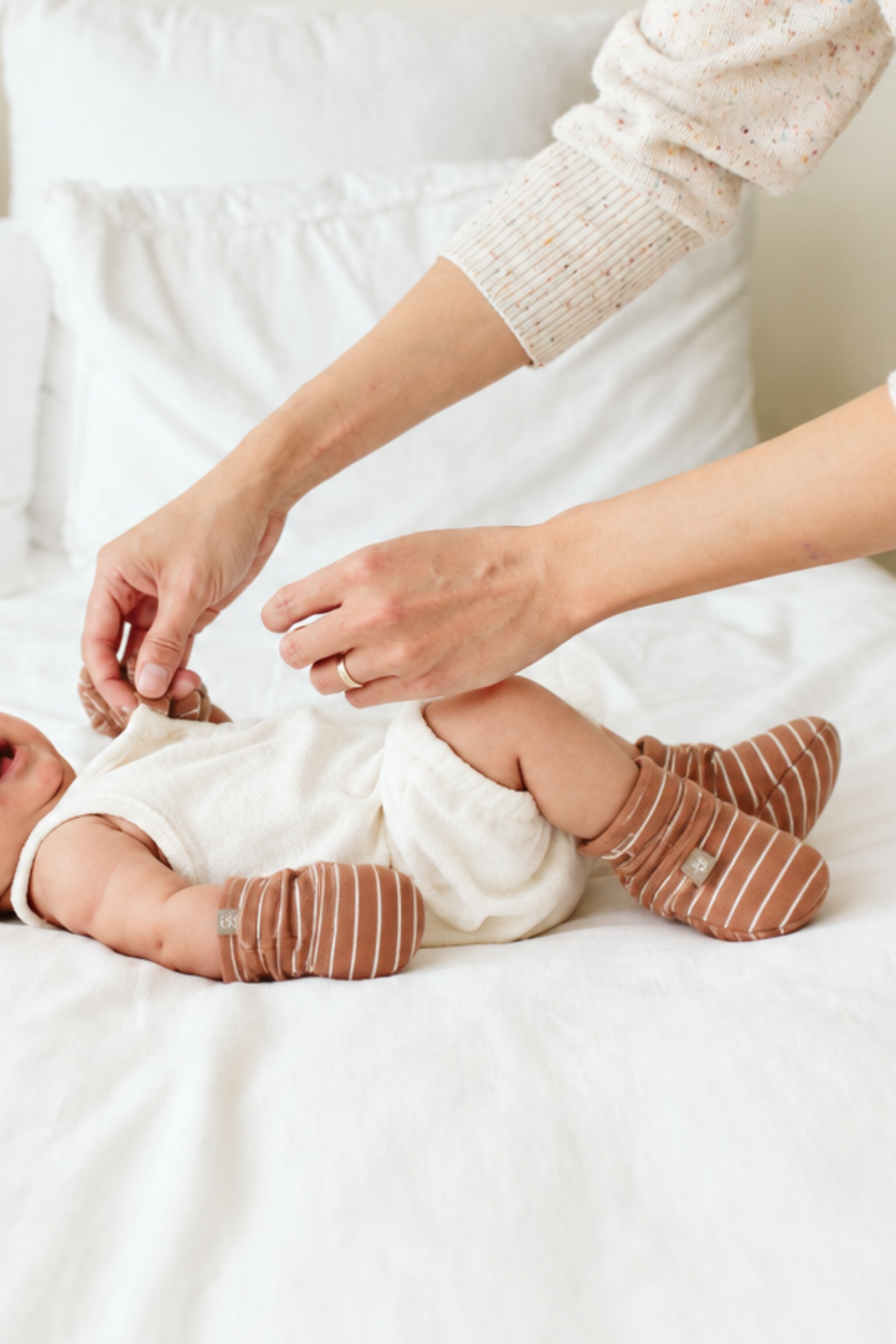 STAY ON 2-PACK BOOTS are soft brown baby boots with thin white stripes and adjustable wraparound closures