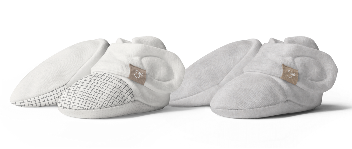 STAY ON 2-PACK BOOTS in soft white and storm gray, with grid-patterned toes and adjustable wraparound closures.