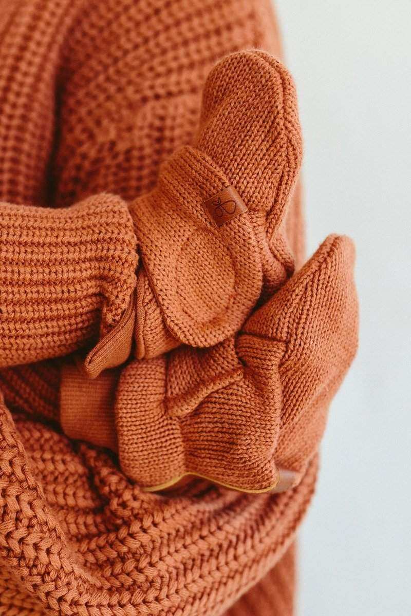 Stay on Knit Boots in rust clay cotton knit, featuring soft ribbed cuffs, adjustable wrap closures and leather tags