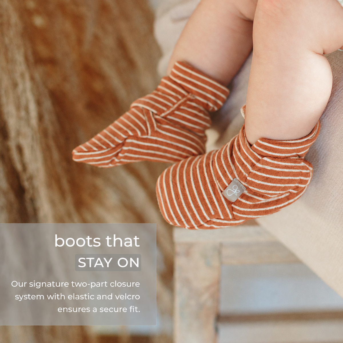 Welcome Home Set includes rust-orange baby boots in soft fabric with thin cream stripes and stay-on wrap closures