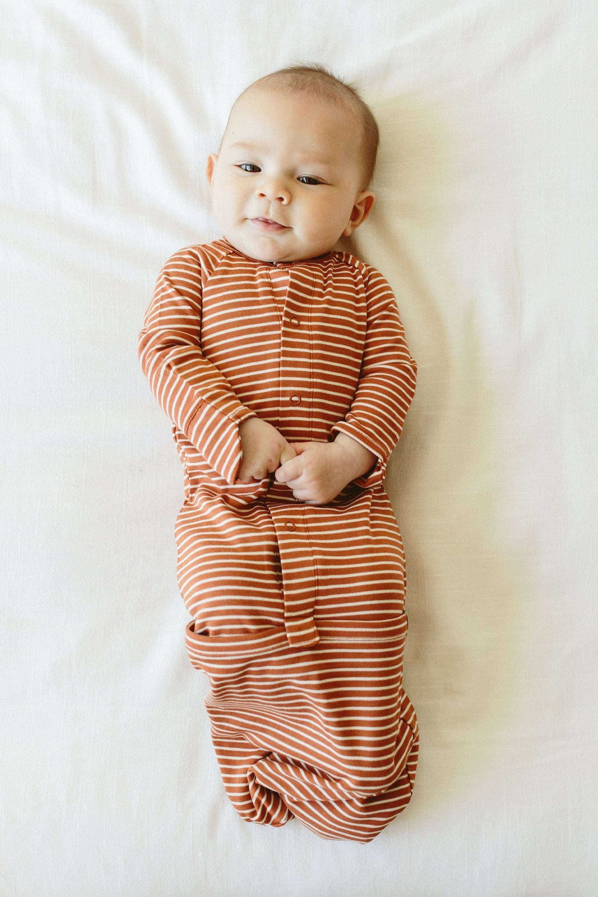 24 HOUR CONVERTIBLE GOWN in clay orange with narrow cream stripes, long sleeves and a gathered convertible bottom