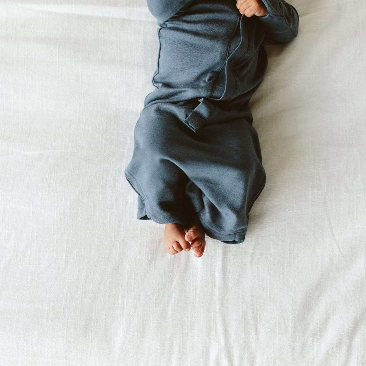 24 HOUR CONVERTIBLE GOWN in midnight blue, with soft solid fabric, long sleeves and a gathered convertible hem