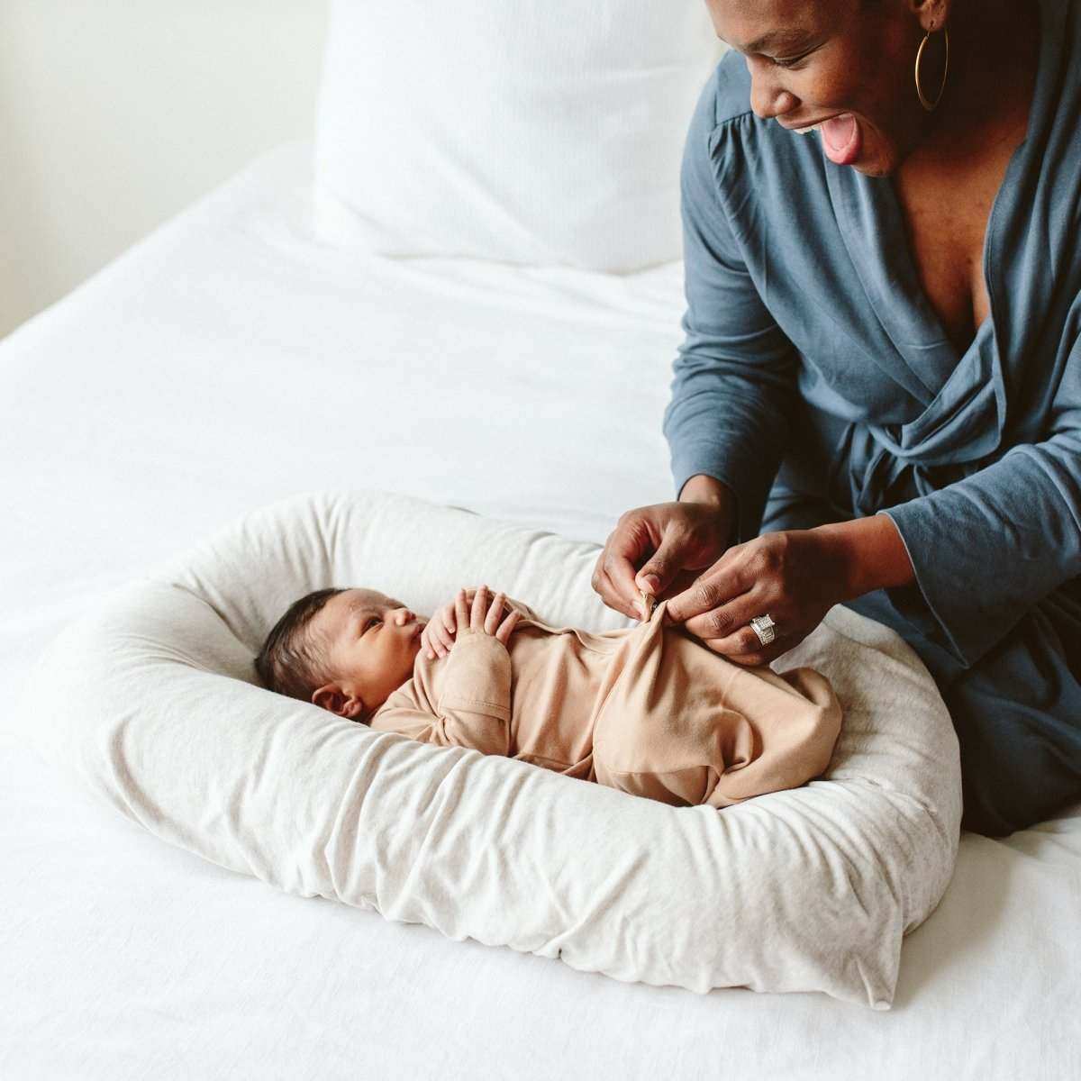 24 HOUR CONVERTIBLE GOWN in sand beige, soft bamboo cotton fabric on a baby with convertible gown closure