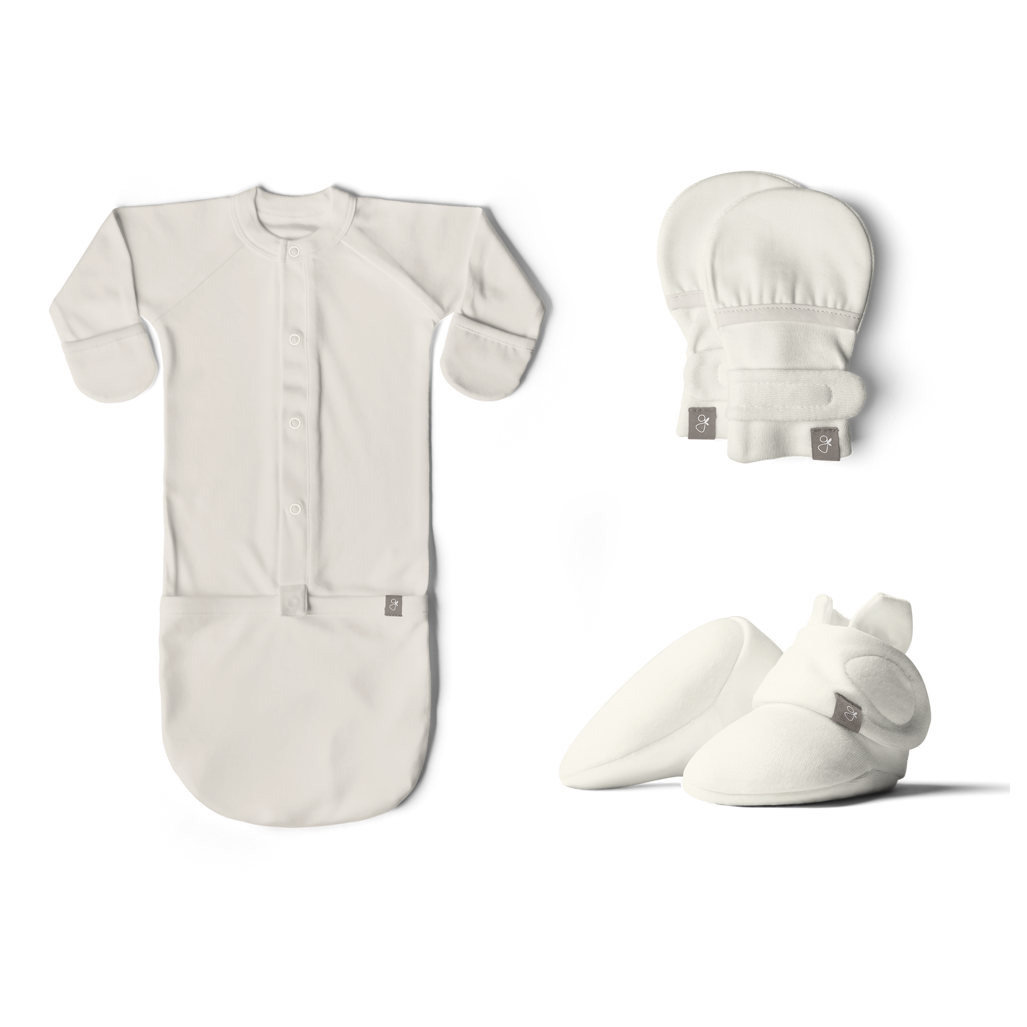 Goumi Kids Cloud Baby Layette Gift Set – stay-on mitts & boots, convertible sleeper gown, grow-with-you footie, gift-packaged – flat lay