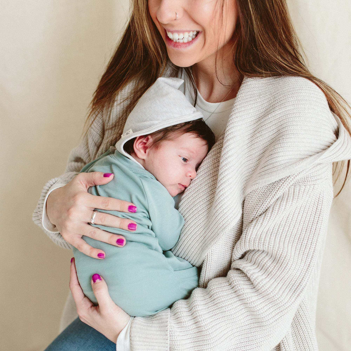 BANDIT BONNET in light gray cotton blend, a soft pointed pixie-style baby bonnet with a simple solid-color design