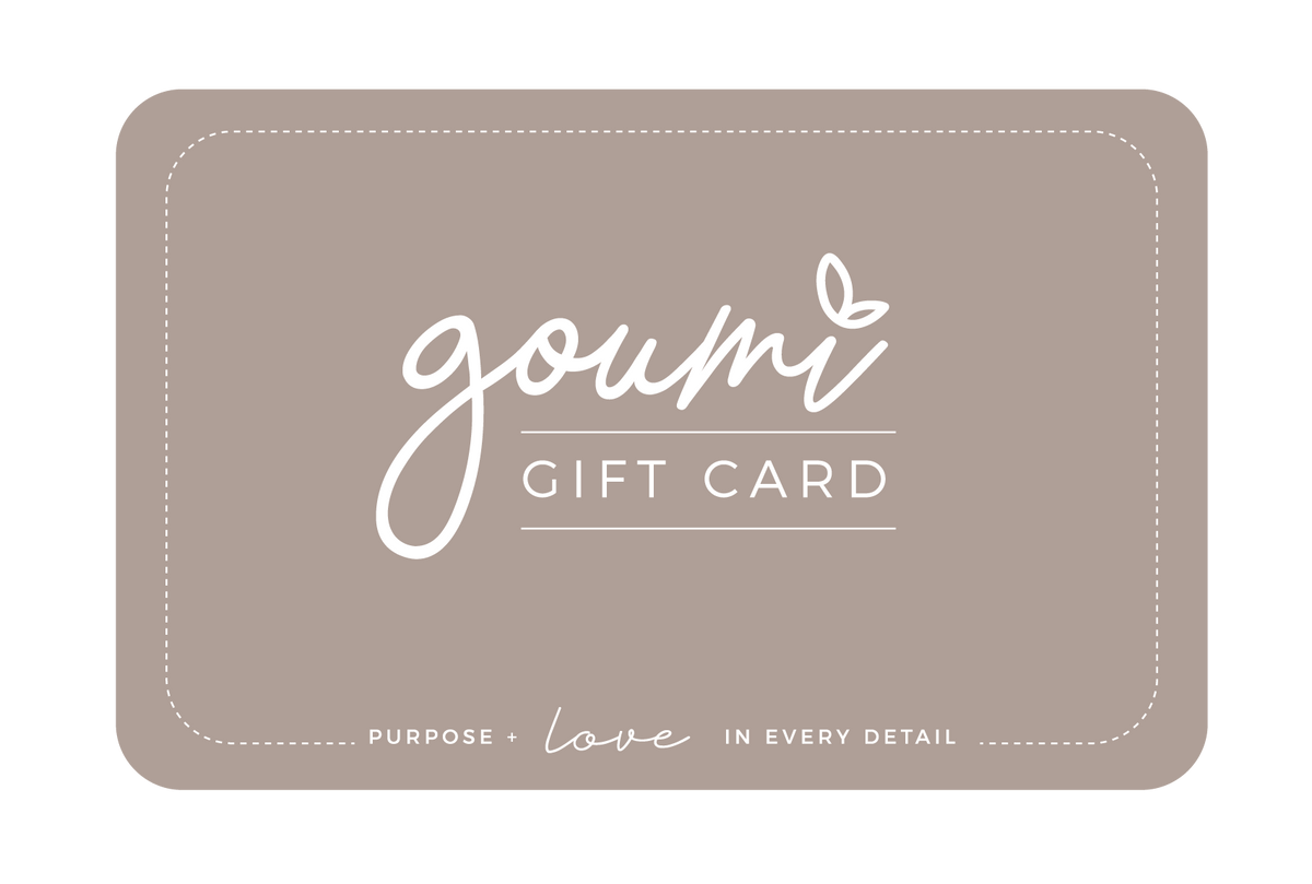 Gift Card in warm taupe with white goumi lettering, a delicate leaf accent and dashed border