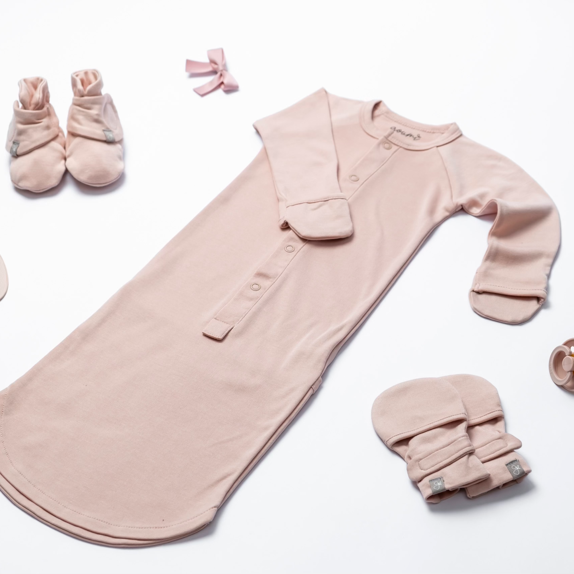Goumi Kids Rose Baby Layette Gift Set – stay-on mitts & boots, convertible sleeper gown, grow-with-you footie, gift-packaged – flat lay