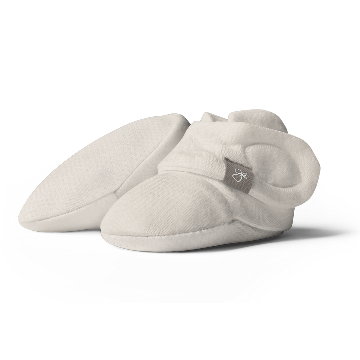 STAY ON BOOTS in soft ivory fabric with rounded toes, adjustable wraparound closures and a small woven logo tag