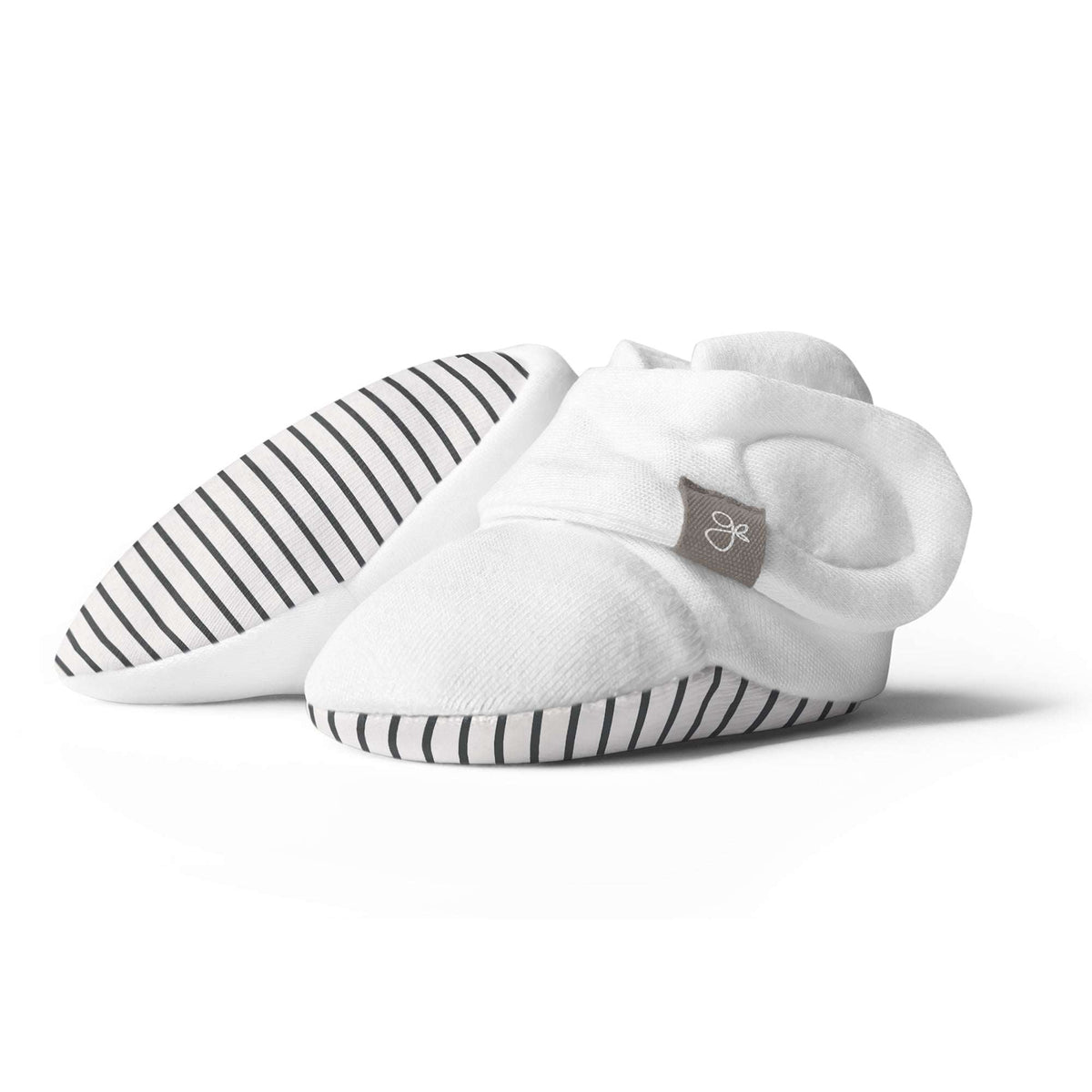 STAY ON BOOTS in soft white fabric with gray stripe-patterned soles and an adjustable wraparound closure