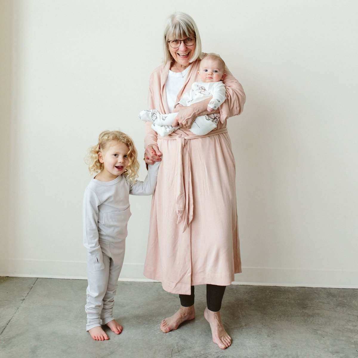 Womens Robe in soft rose pink with a solid pattern, wrap front, waist tie and three-quarter sleeves